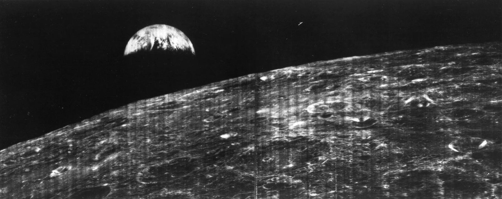 LUNAR ORBITER 1'S FIRST VIEW OF EARTH FROM THE MOON, AUGUST 23, 1966 — TRANSMITTED ON KODAK-PROCESSED FILM. NASA. (PUBLIC DOMAIN)